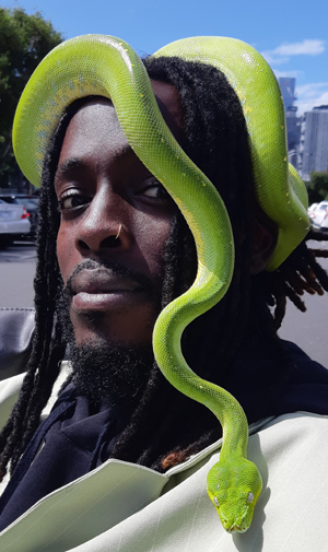 Black man with green snake